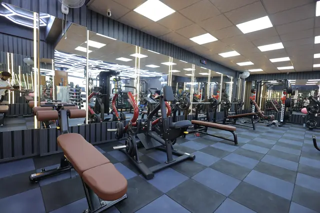 Wide view of the training floor at Club10 Fitness Sonipat